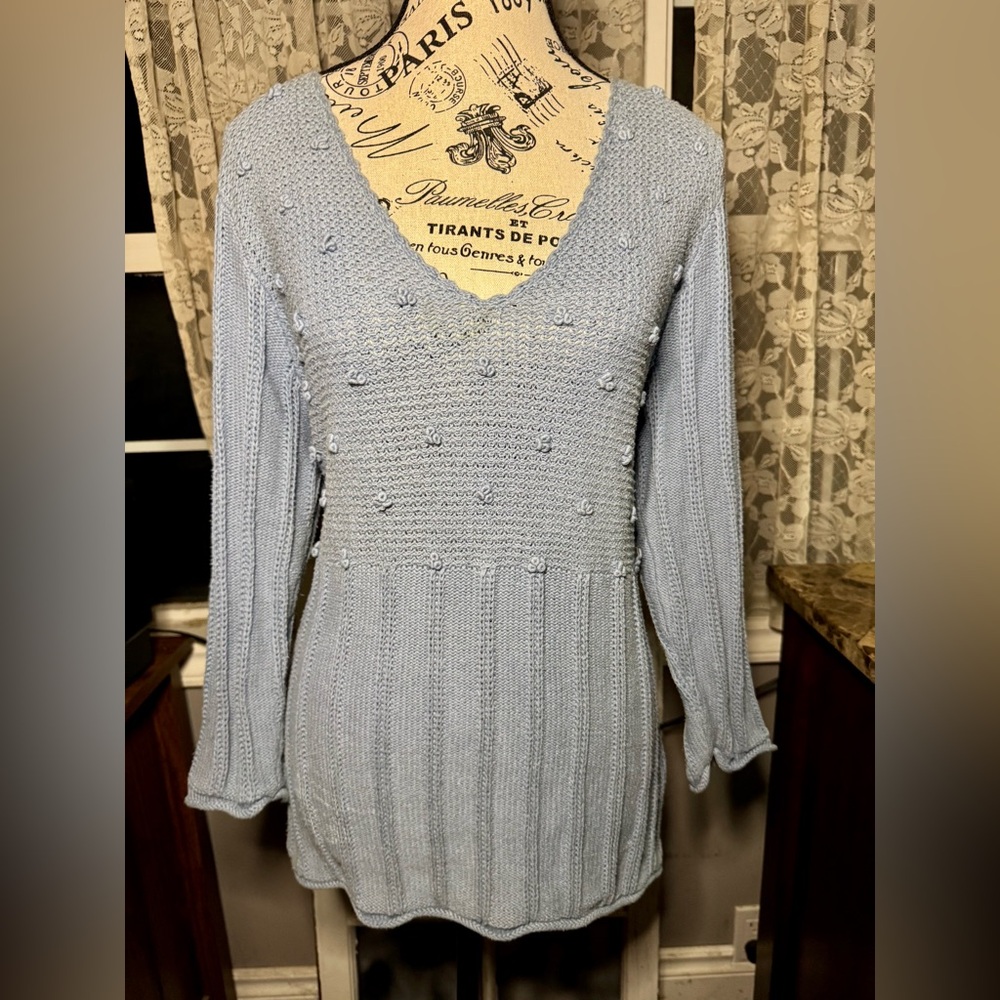 Textured knit sweater with empire waist.